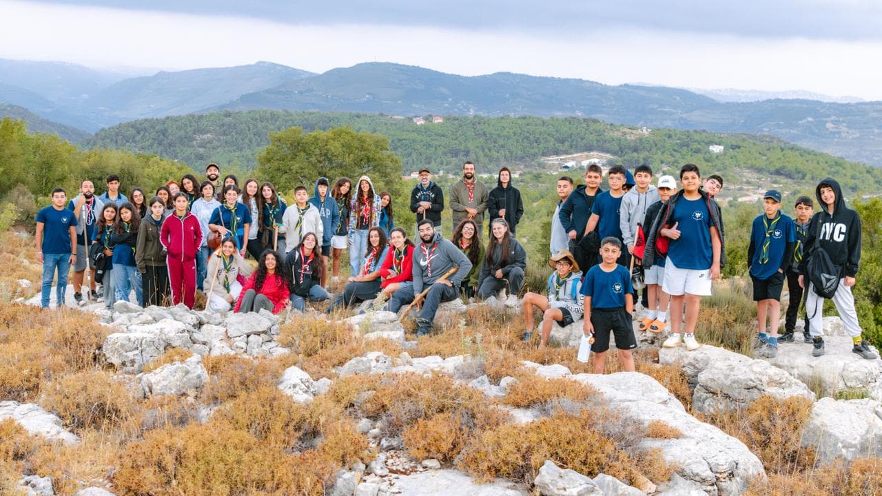 Scouts group photo with mountain backdrop